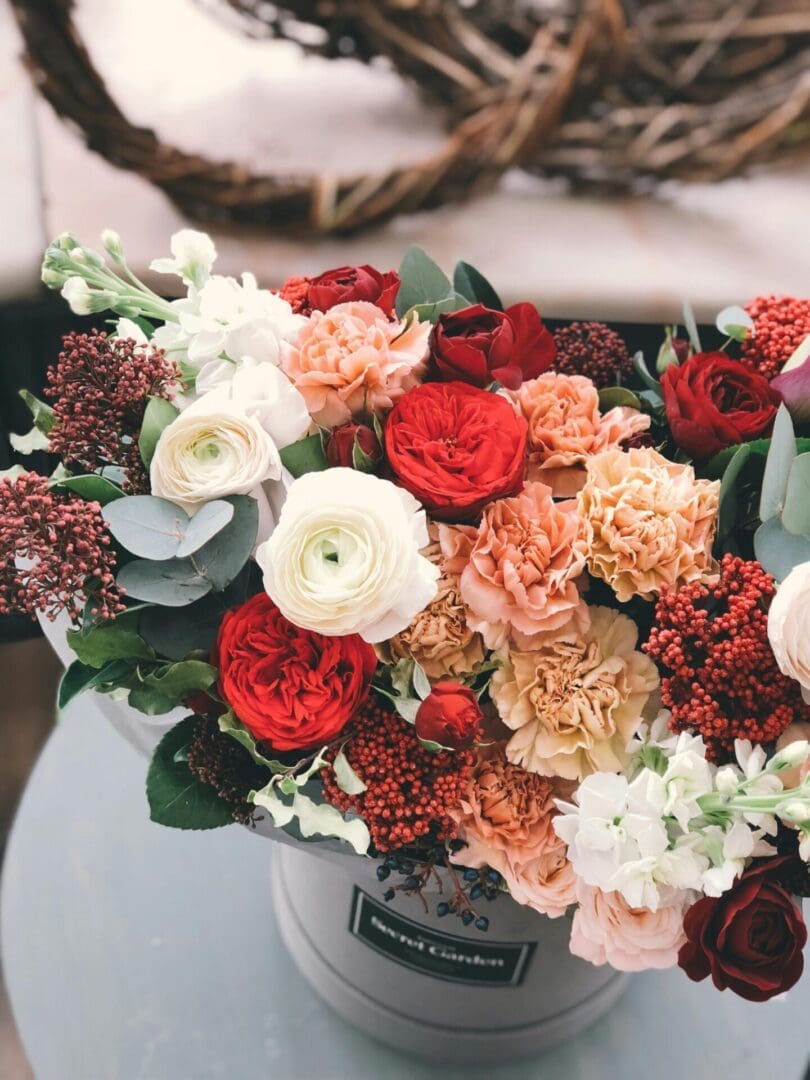 A bouquet of flowers sitting on top of a table.