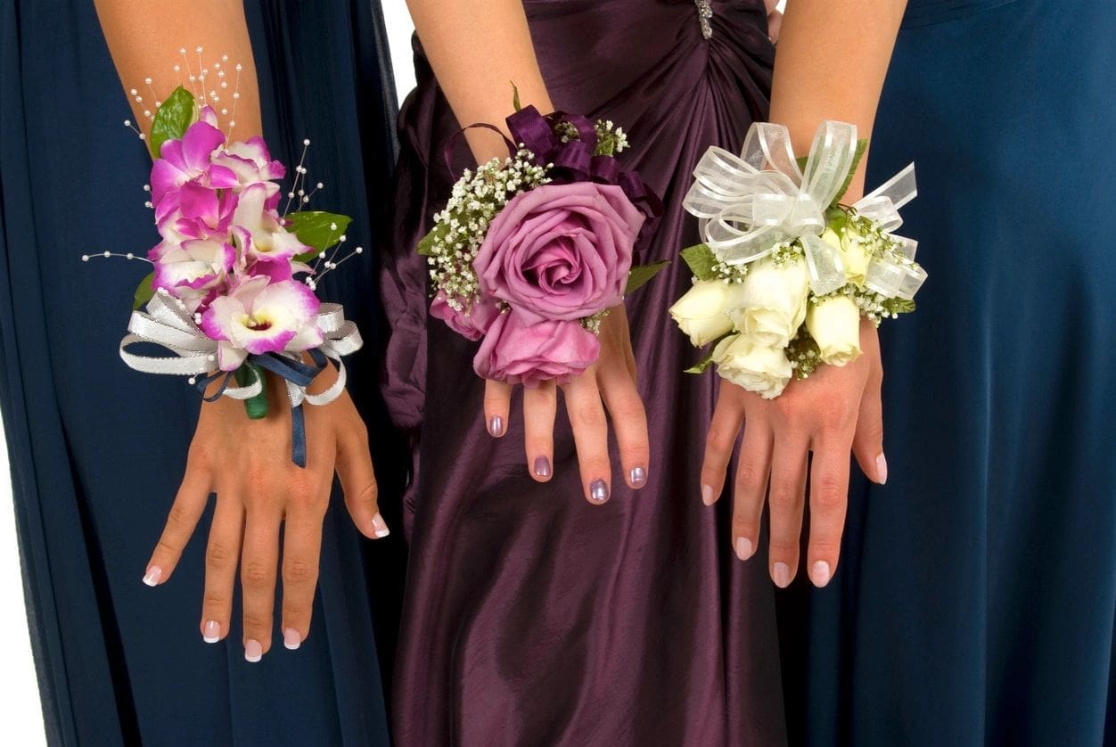 A group of women holding flowers in their hands.