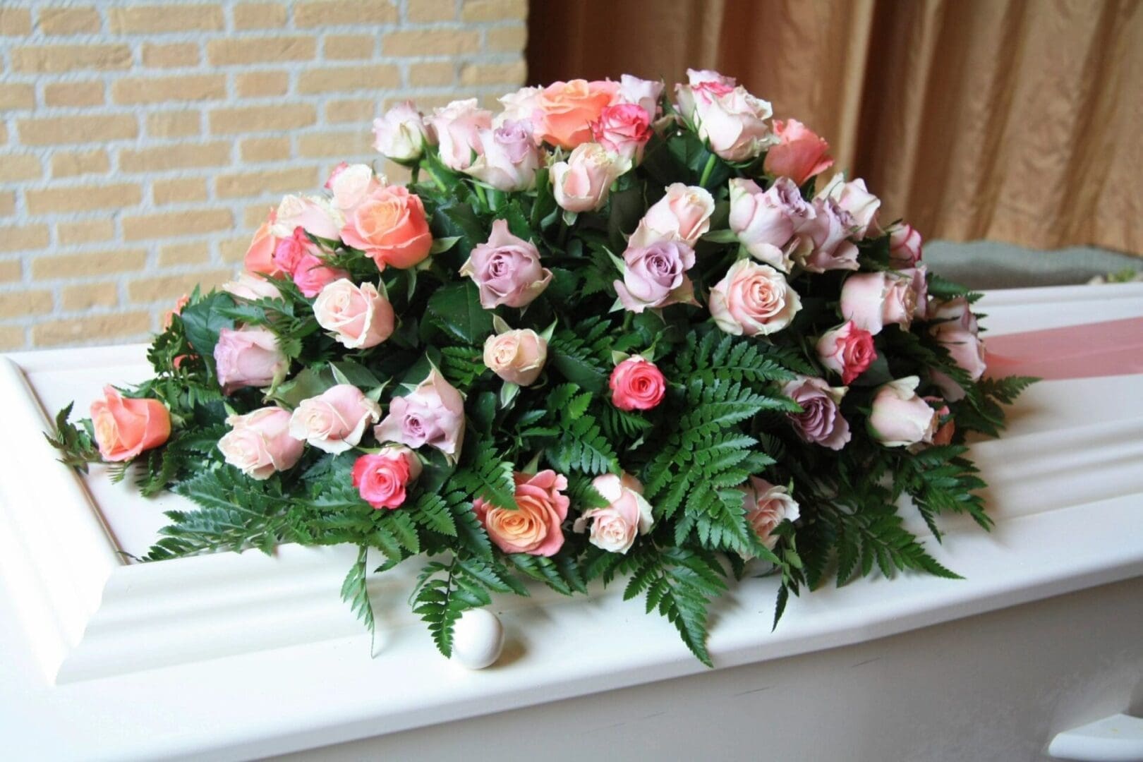 A bouquet of roses on top of a table.