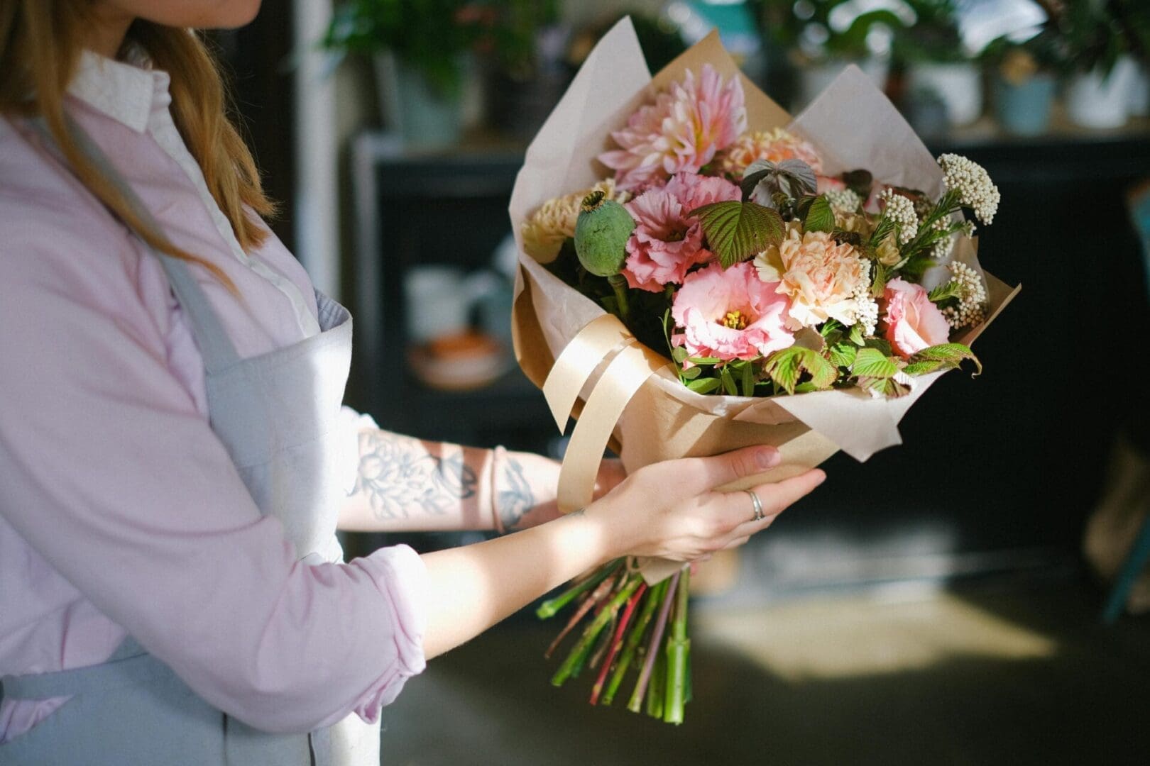 A woman holding flowers in her hands.